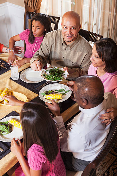 istock Multi-generation African American family at dinner table 186613496