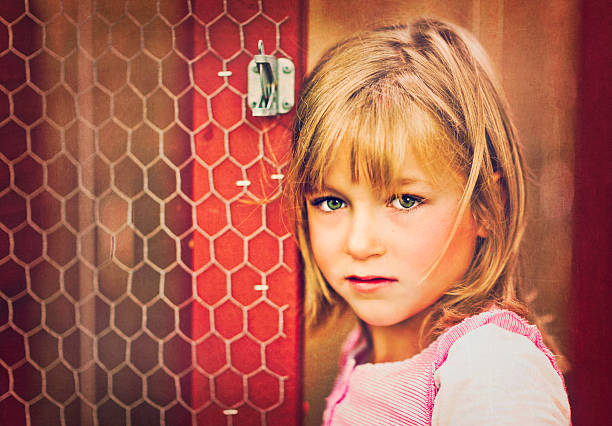Little Girl Standing Inside Chicken Coop