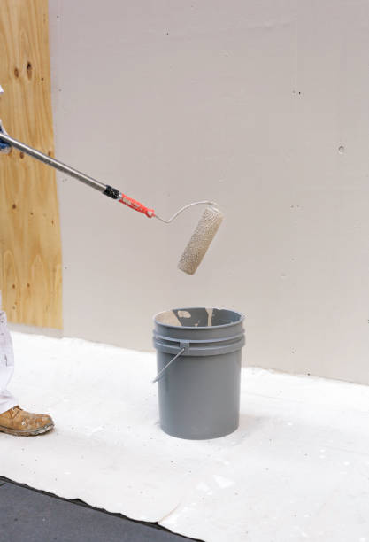 istock Worker working on painting wood with white color. 1866160861