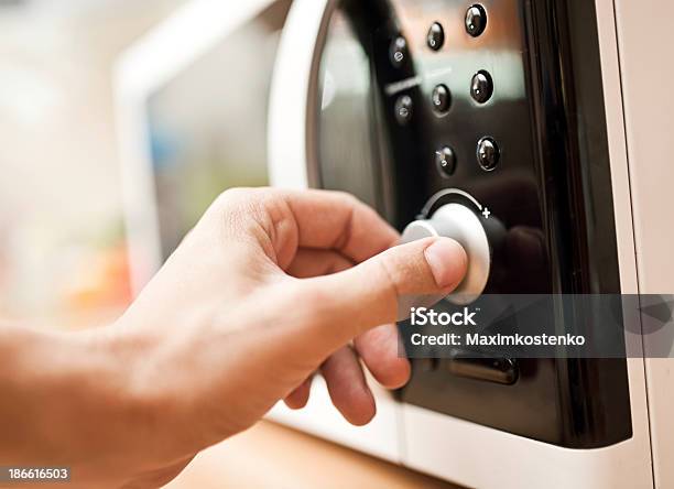 Hand Setting The Controls On A Microwave Oven Stock Photo - Download Image Now - Appliance, Chef, Closed