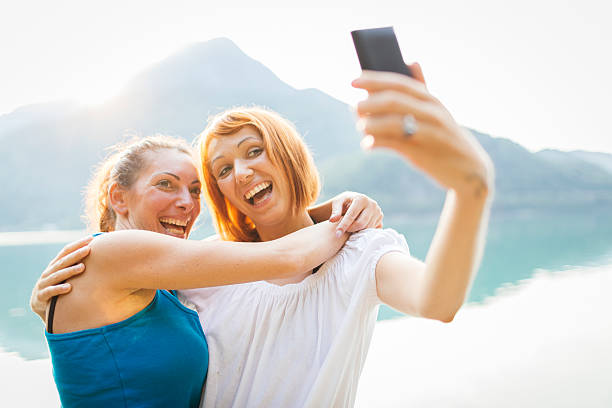 istock Two girls taking self photograph 186617315