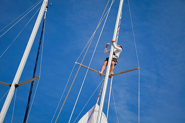Sailor repairing on sail