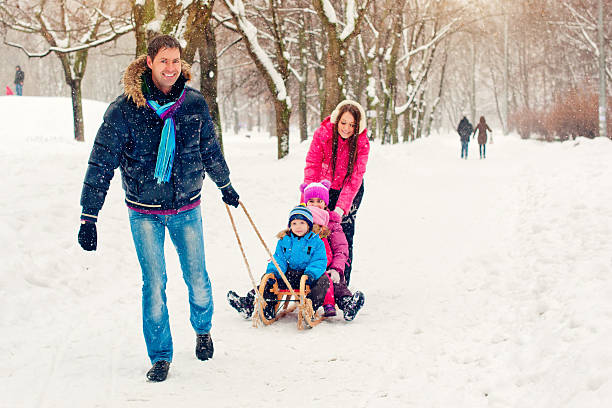 istock Family in a winter park 186617469