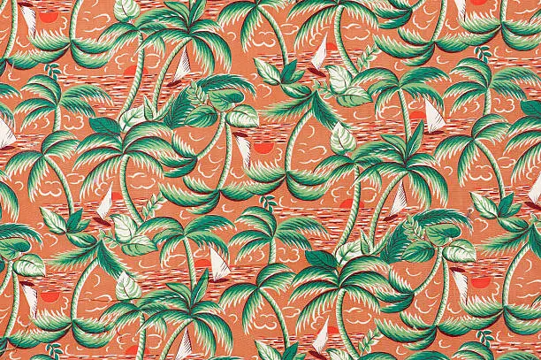 Vintage fabric background depicting colorful palm trees and sailboats on an orange background from the era of 1962 to 1972.
