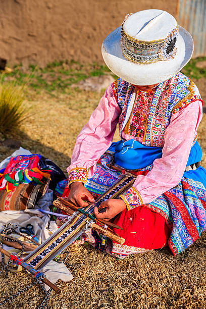 istock Peruvian woman weaving near Colca Canyon, Peru 186619003
