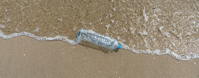 Plastic water bottles pollution in ocean. Environment concept.