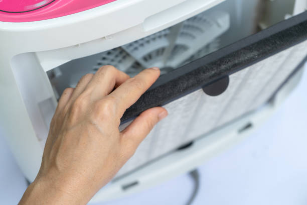 istock Close up on hand to remove old air purifier filter (Hepa filter) with dust on it. 1866211775