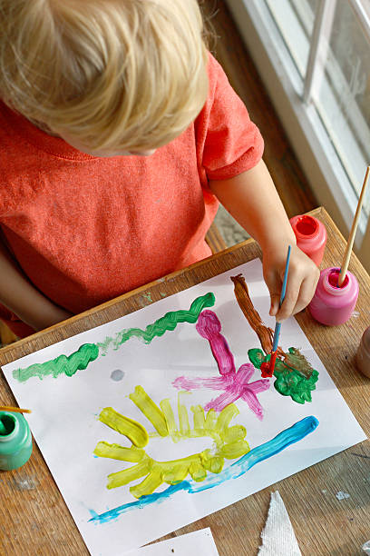 istock Young Child Painting Picture 186621348