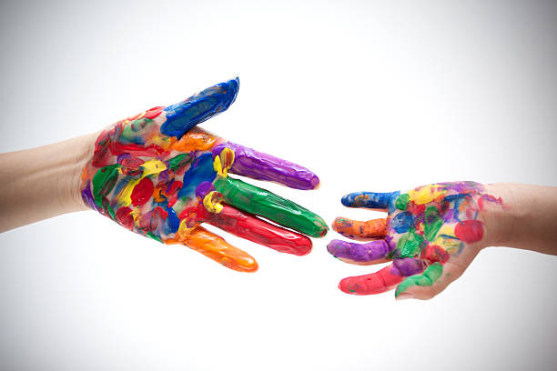 Two colorful hands with mother and son