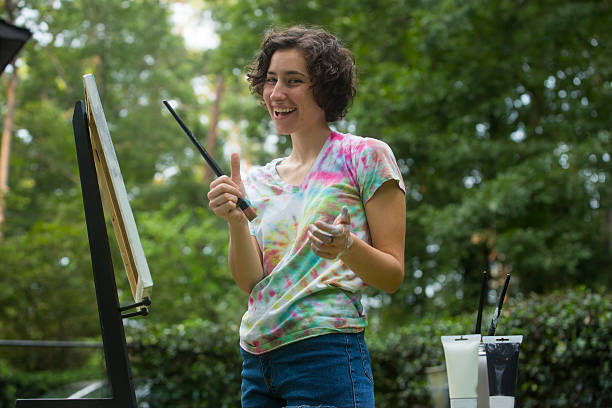istock Young Woman Painting 186621912
