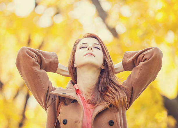 istock Redhead girl in autumn park 186622098