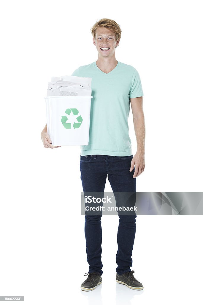 Let's recycle! A friendly young red-headed man holding a recycling bin filled with newspapers 20-24 Years Stock Photo