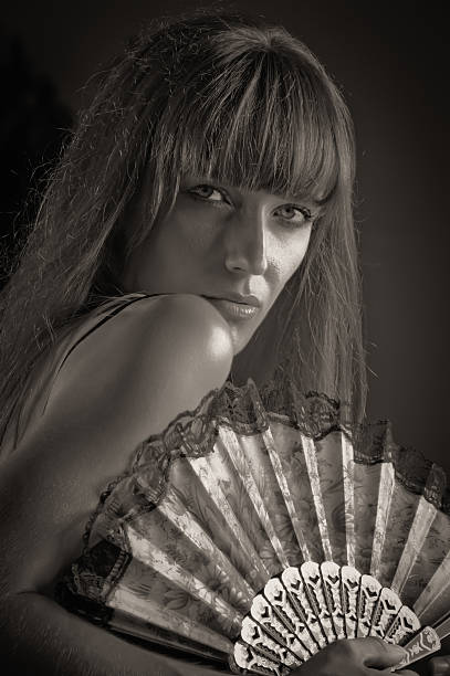 istock Woman with Hand Fan 186622495