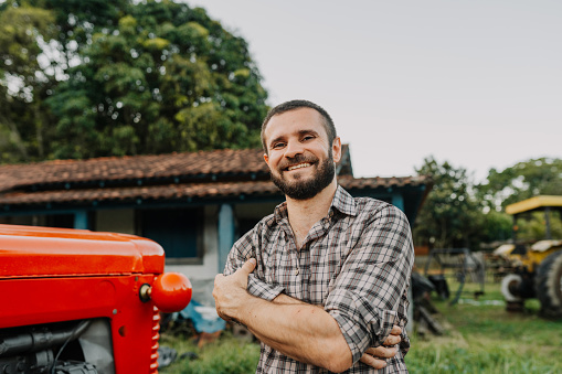 Portrait of a smiling farmer in the yard