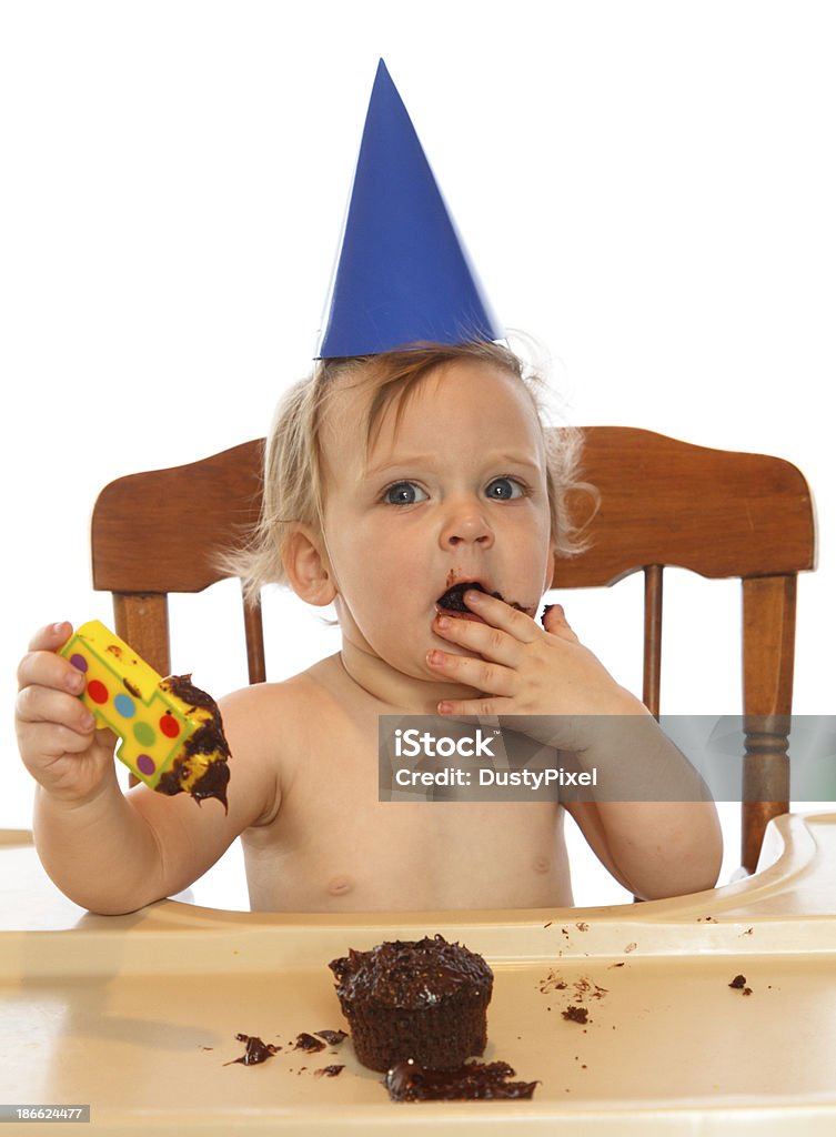 Baby's First Birthday Baby boy eating birthday cake with number one candle Baby - Human Age Stock Photo