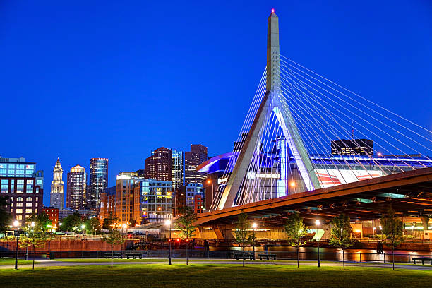 Zakim Bunker Hill Bridge Zakim Bridge and the downtown Boston skyline. The Leonard P. Zakim Bunker Hill Bridge, is a cable-stayed bridge across the Charles River and was part of the Big Dig Project in Boston. The Big Dig, was the largest highway construction project in the United States. The Zakim Bridge is the widest cable-stayed bridge in the world.  charles river stock pictures, royalty-free photos & images