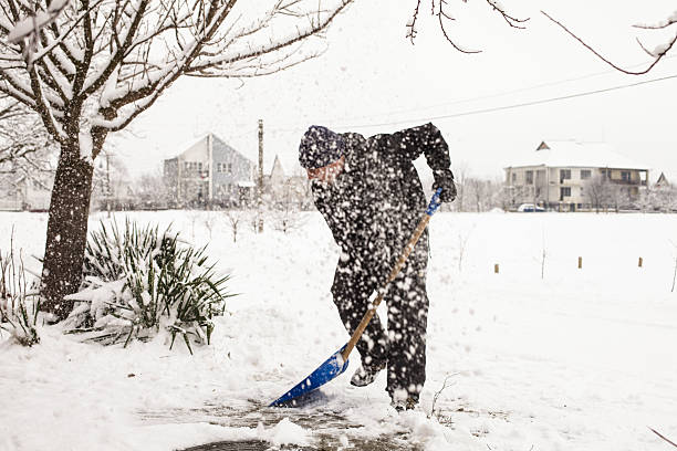 istock Man shoveling snow off the road 186626914