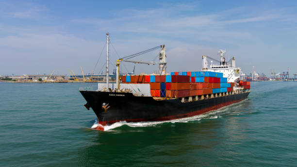istock cargo container shipping sailing in sea import export logistic goods and distributing products to dealer and consumers across worldwide, by container ship Transport, business service. 1866279299
