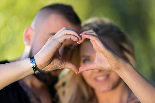istock Couple Forming A Heart 186628098