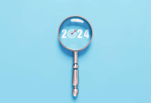 istock magnifying glass shows the new year 2024 1866333884
