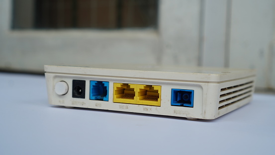 modem with several yellow and blue ports.