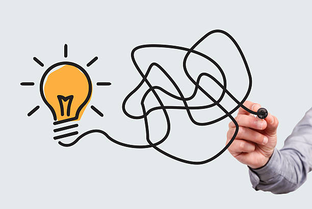 istock Hand of a business drawing Lightbulb 186634573