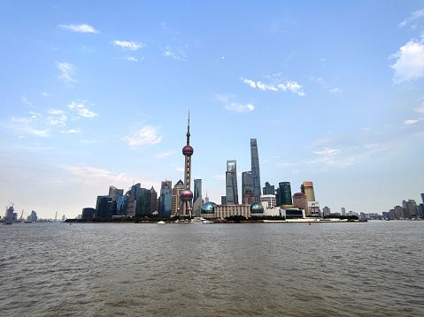 View of Huangpu River and the futuristic Lujiazui finance and trade zone skyline, viewed from the Bund, Shanghai, China
