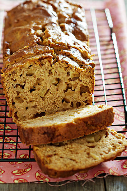 istock Cake with pieces of apples sliced on a cooling rack 186635546