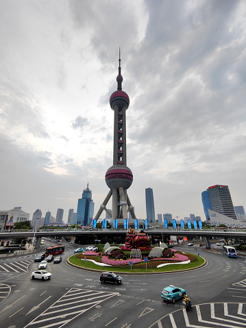 Traffic circle at the iconic Oriental Pearl Tower. height 468 mt in Lujiazui finance and trade zone, Shanghai, China
