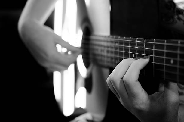 istock Guitar lesson with female hands playing. 186635645