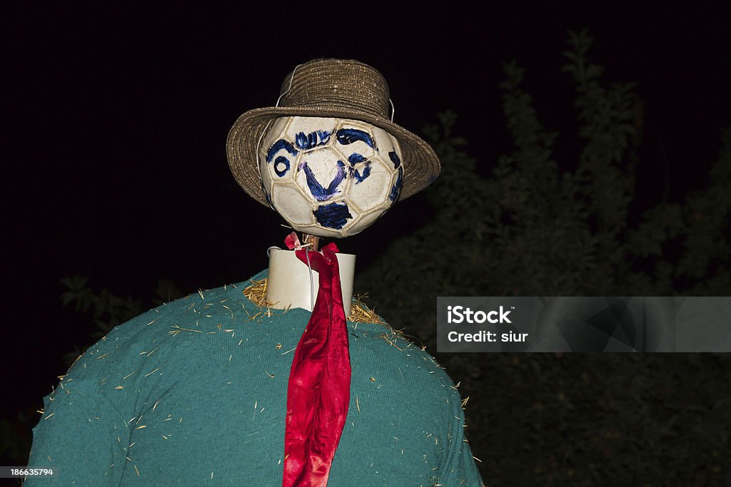 Scarecrow - Espantapajaros Scarecrow at night with soccer ball head and straw hat Agriculture Stock Photo