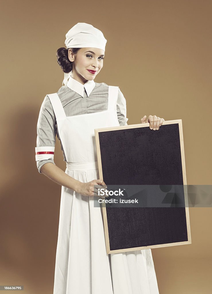 Retro Krankenschwester holding Tafel - Lizenzfrei Sinnlichkeit Stock-Foto