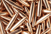Full-frame background photo of golden metal bullets