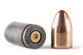 Demounted bullet shell 9mm set on white background