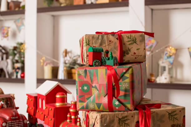 istock Stacks of Christmas presents. Christmas preparation concept. Stack of different colorful boxes for every family member. Pile of gifts in bright festive wrapping. 1866431158