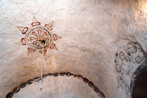 Frescoes painted on the ceiling inside the ancient 1731 ruin of Mission Concepcion, San Antonio, TX, USA