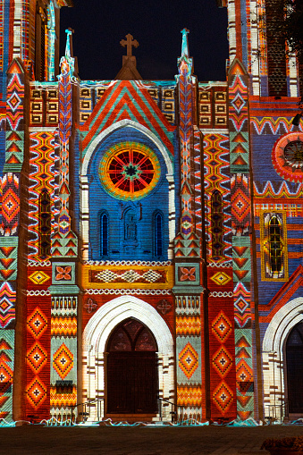 Colorful geometric designs on the facade of the San Fernando Cathedral at night, San Antonio, Texas, USA