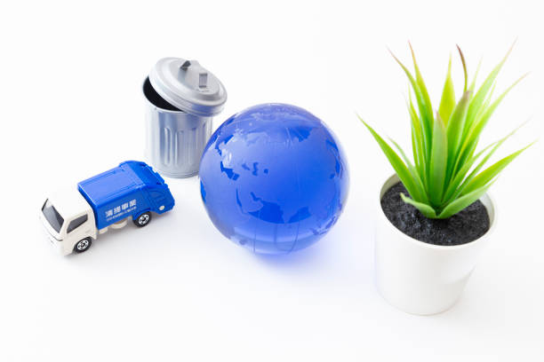 istock Garbage truck, trash can and earth. 1866443664