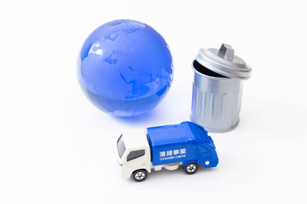 istock Garbage truck, trash can and earth. 1866445725