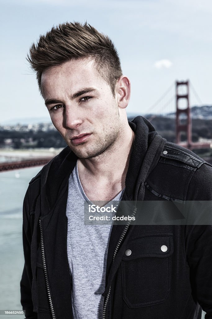 Young Man Near Golden Gate Bridge A young man with the Golden Gate Bridge in the background. Men Stock Photo