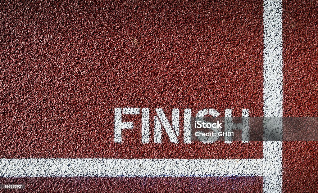 Finish painted in white on red asphalt The Finish Line on a Track Field Finish Line Stock Photo