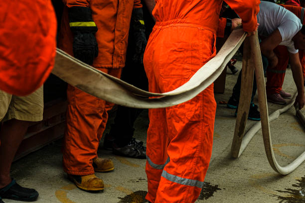 istock stcw firefighting prevention training, folding fire hose reel ,  maritime courses 1866572105