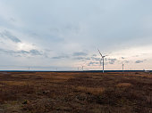 a wind turbine rotates in close-up on a beautiful background