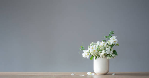 istock white summer flowers on gray background 1866577344