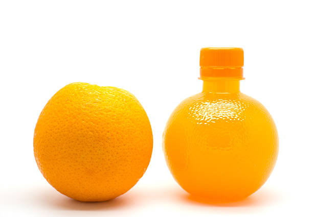 istock Slice and a bottle of fresh orange juice 186658295