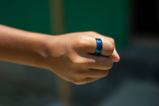 A man is making his fists and blurred background
