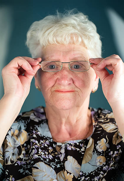 istock old woman wearing glasses 186660206