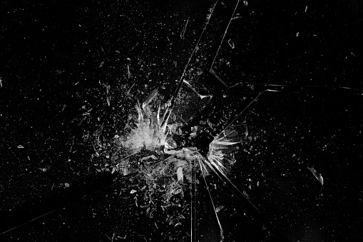 Shattering window glass. Against a White background.