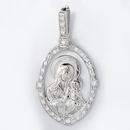 Gold pendant with the Virgin Mary christian symbol isolated white
