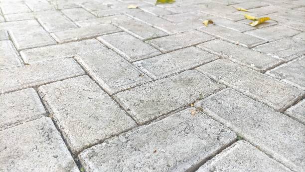 istock Perspective View Monotone Gray Brick Stone Pavement in Ground for Walkway. Pavement, Driveway, Pavers, Sidewalks on Vintage Ground Floor Pattern Square Texture Background Design for mock up 1866627530